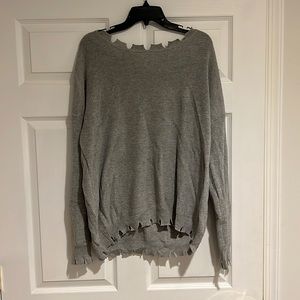 Grey long sleeve “ripped” knit shirt